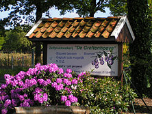 Bord aan de straat bij blauwe bessen kwekerij De Greftenhoeve